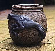 An earthenware pot with Greyhound